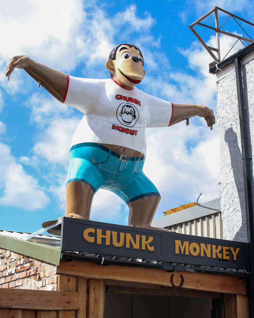 Chunk, the 10-foot fibreglass monkey standing on top of the workshop rooftop in Sandfields, Swansea
