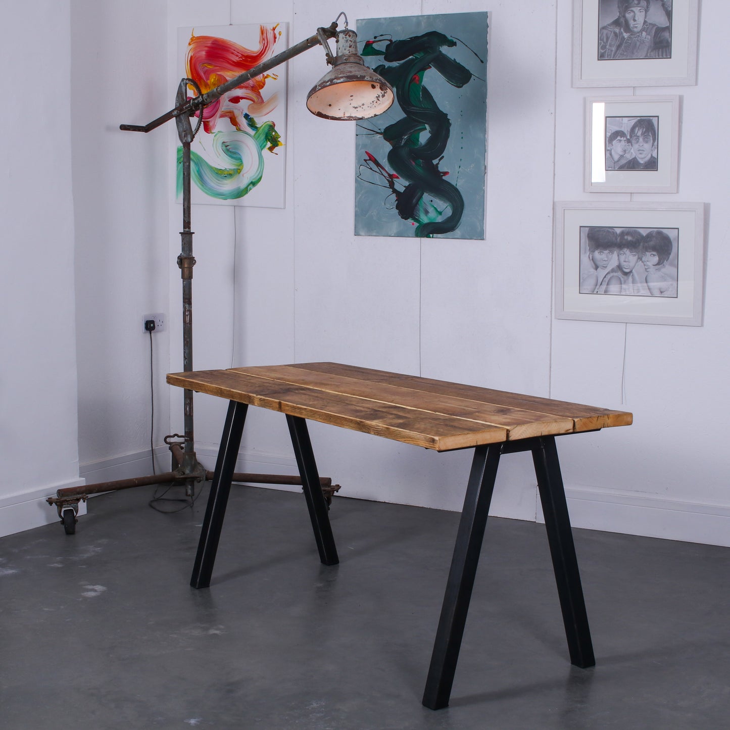 Reclaimed scaffold board table, natural oil stain, three boards wide, with Chunk Two legs in a rustic industrial setting
