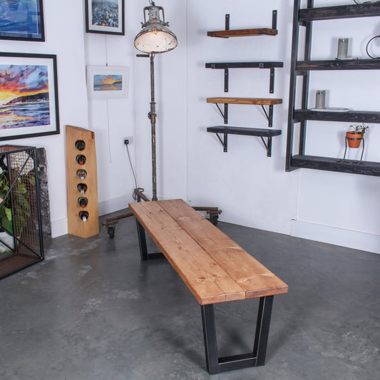 Extra Chunky Chunk One bench in a rustic industrial setting. Features U shaped legs and a farmhouse stain.