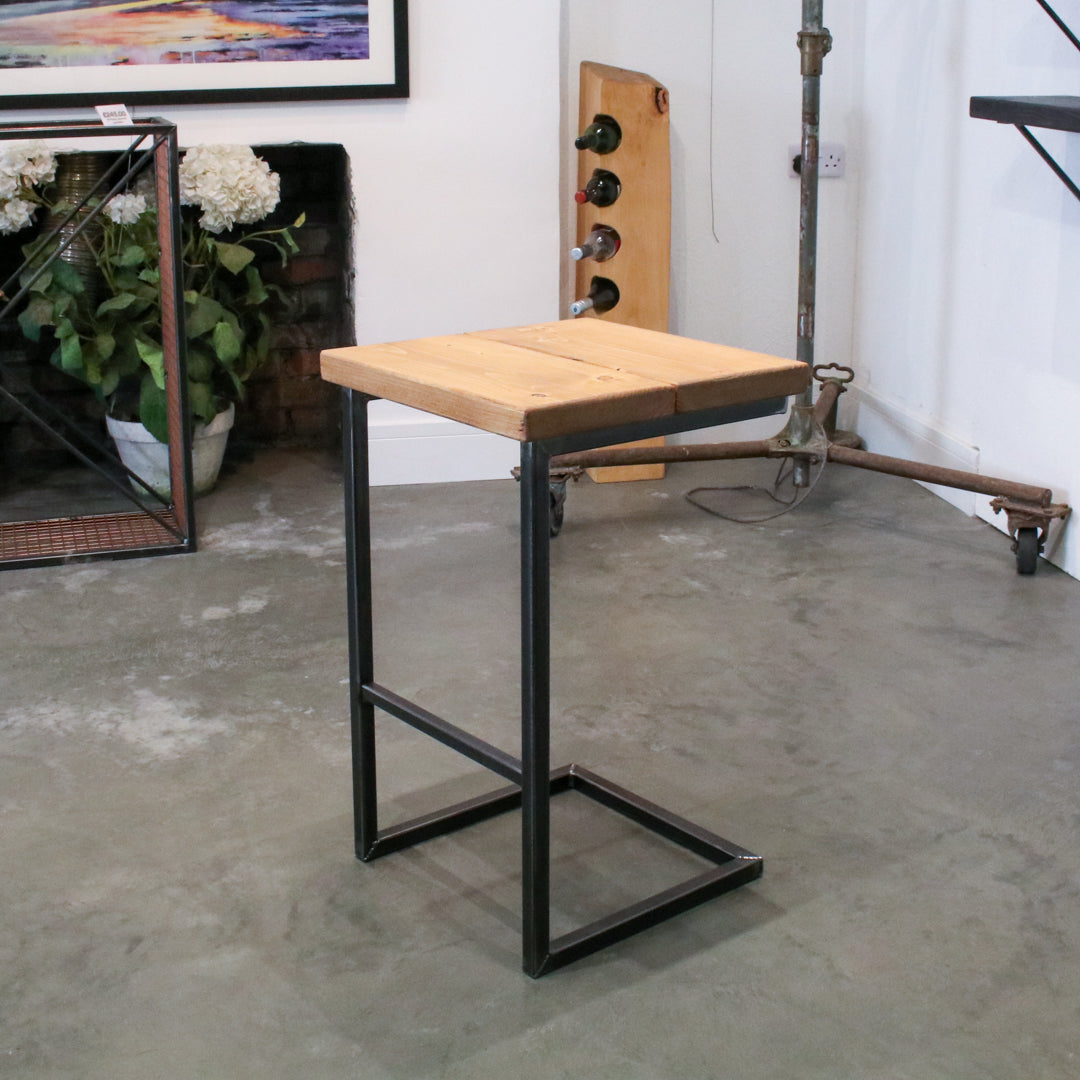 Rustic industrial stool with footrest and Extra Chunky farmhouse seat on a high cantilever frame.