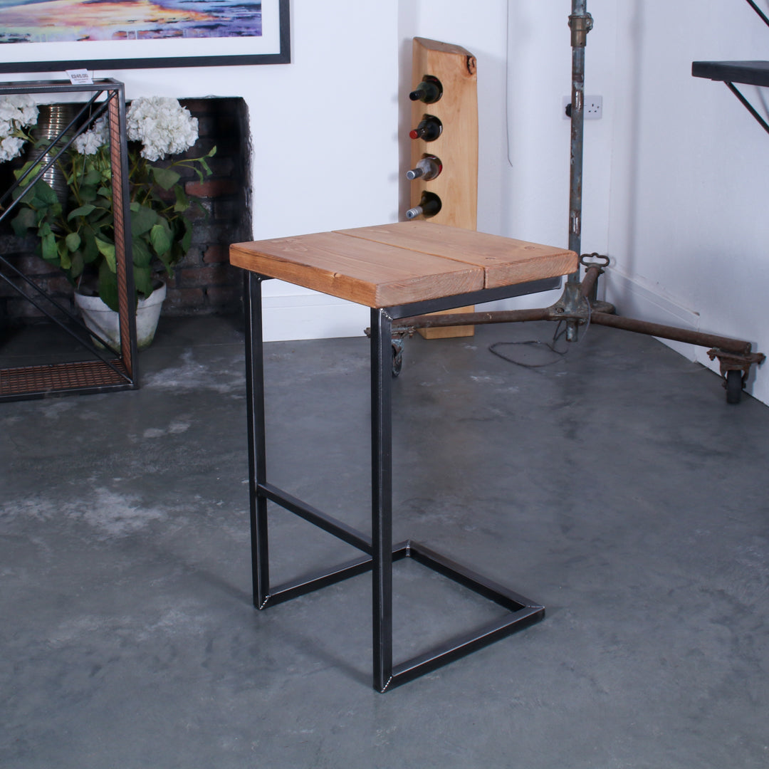 Rustic industrial stool with footrest and Extra Chunky farmhouse seat on a high cantilever frame.