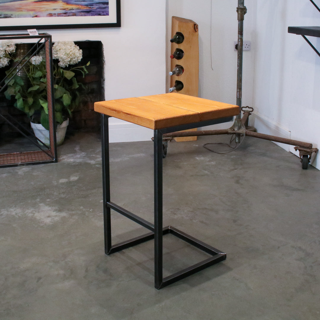 Rustic industrial stool with footrest and Extra Chunky light oak seat on a high cantilever frame.
