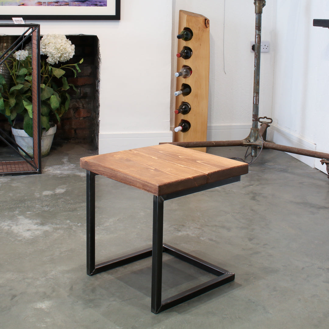Rustic industrial stool with footrest and Extra Chunky light walnut seat on a low cantilever frame