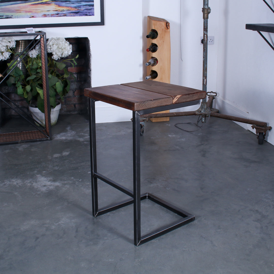 Rustic industrial stool with footrest and Extra Chunky walnut seat on a high cantilever frame