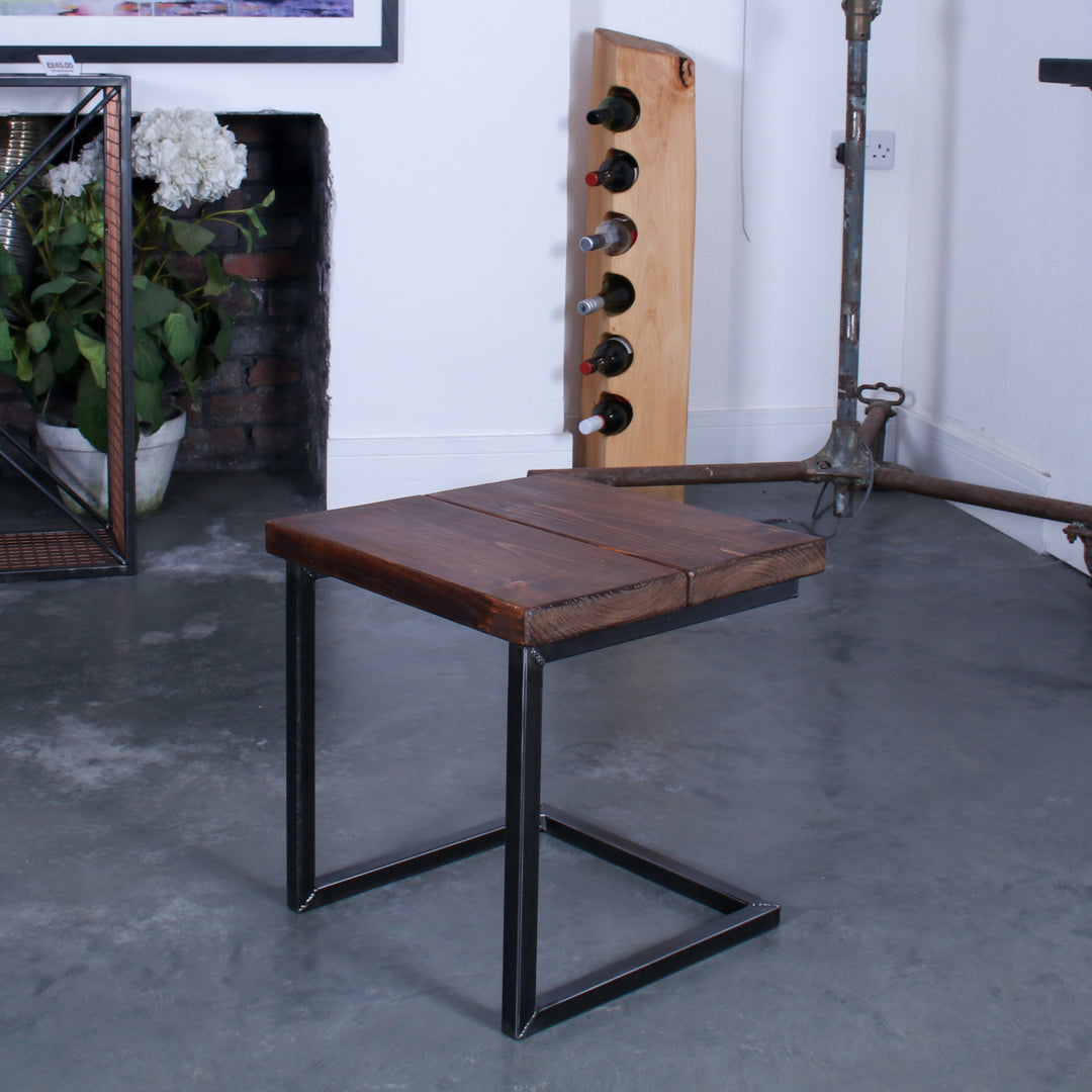 Rustic industrial stool with footrest and Extra Chunky walnut seat on a low cantilever frame