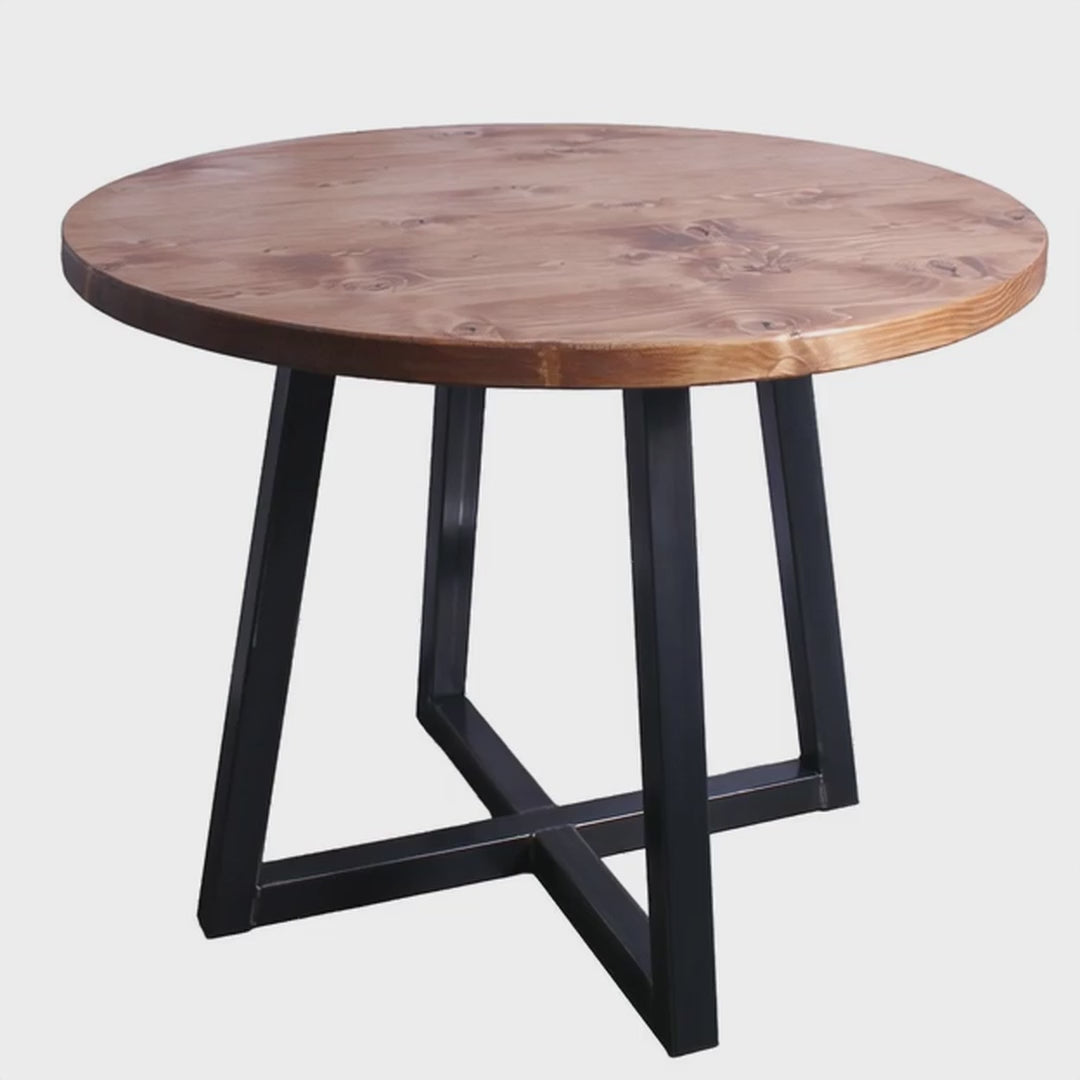 A 3D view of a round table with quadpod legs rotating in a studio setting