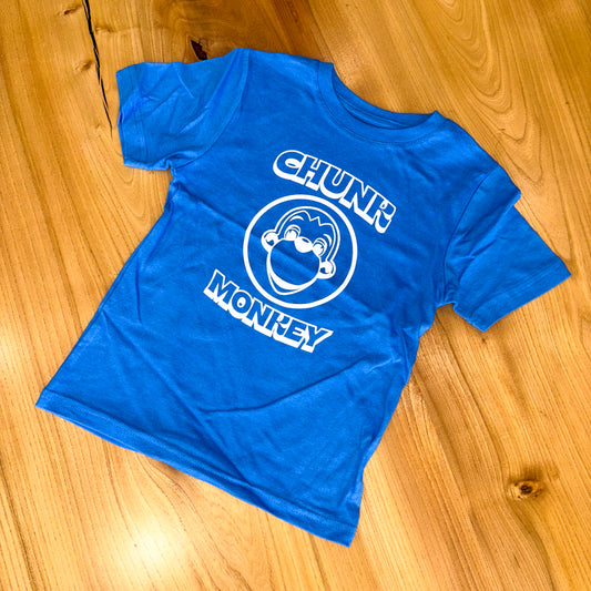 Blue t-shirt with 'Chunk Monkey' logo on a wooden floor