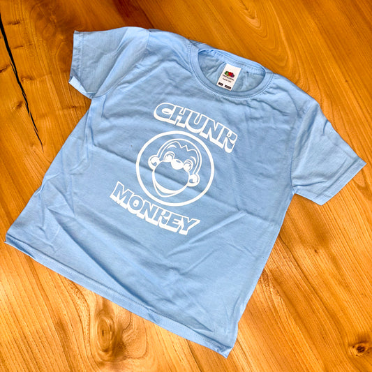 Light blue t-shirt with 'Chunk Monkey' graphic on a wooden surface