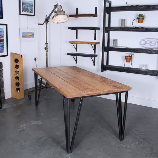 Farmhouse stained dining table made from four 'Extremely Chunky' boards with chunkier 25mm hairpin legs in a rustic industrial setting