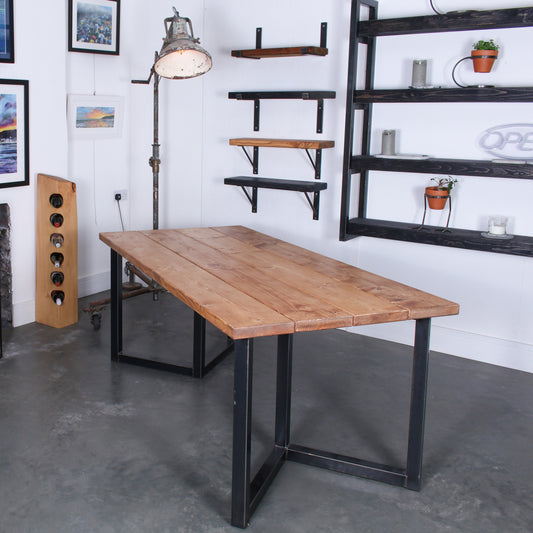 Extra Chunky 4 board solid wood dining table featuring 'Chunk Three' legs in rustic industrial room