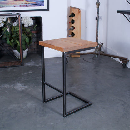 Rustic industrial stool with footrest and Extra Chunky farmhouse seat on a high cantilever frame.