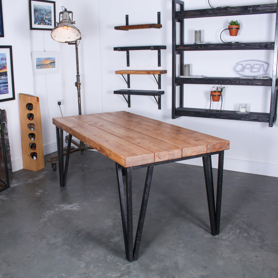 Farmhouse stained dining table made from four 'Extremely Chunky' boards with chunkiest hairpin legs in a rustic industrial setting