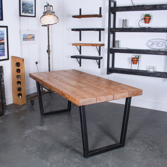 Farmhouse stained Extremely Chunky 4 board solid wood dining table featuring 'Chunk One' legs in rustic industrial room