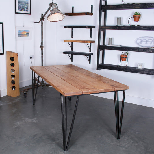 Farmhouse stained dining table made from four 'Extremely Chunky' boards with slim ChunkPin 20mm hairpin legs in a rustic industrial setting