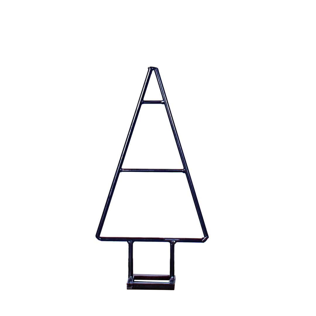 Rustic industrial small steel Christmas tree in a studio setting.