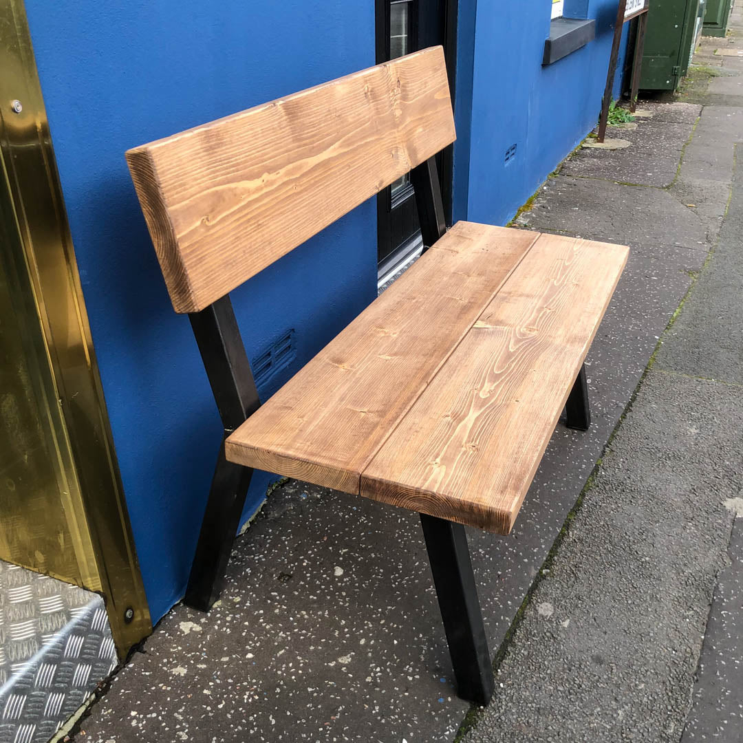 close up side shot of the rustic industrial extra chunky farmhouse bench shot outside of our Swansea shop