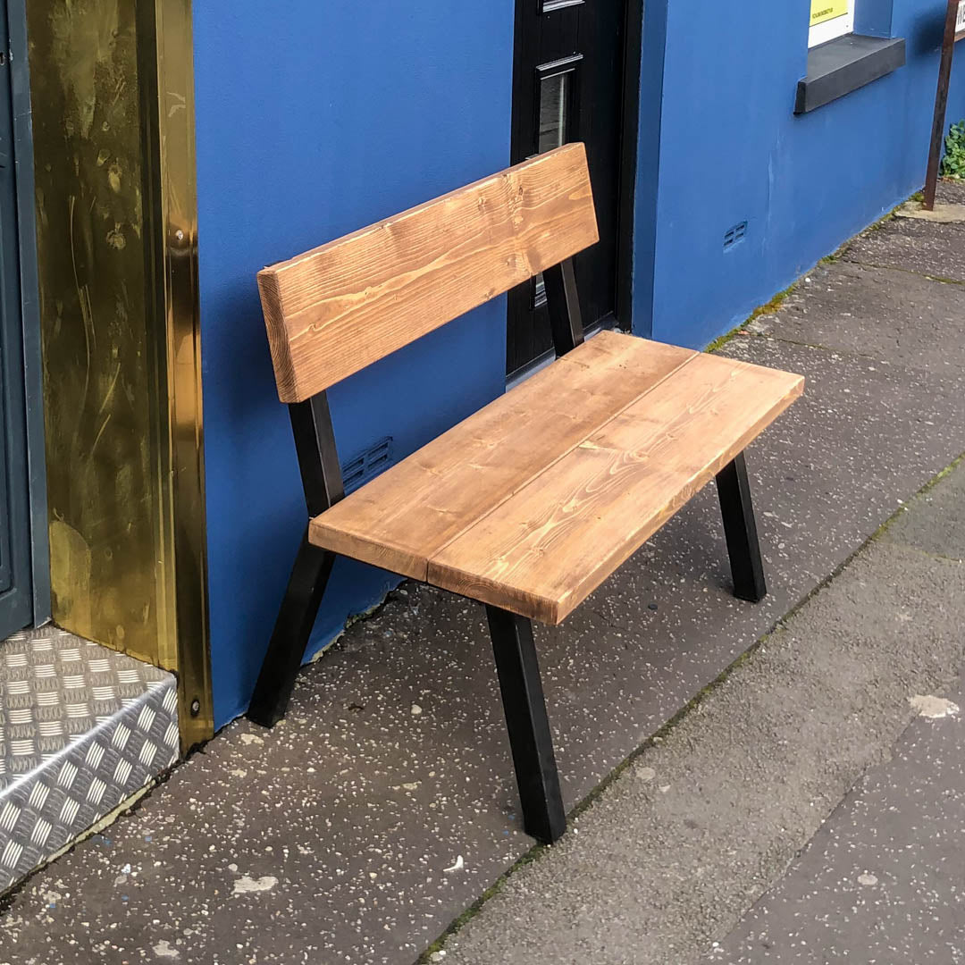 close up side shot of the rustic industrial extra chunky farmhouse bench shot outside of our Swansea shop